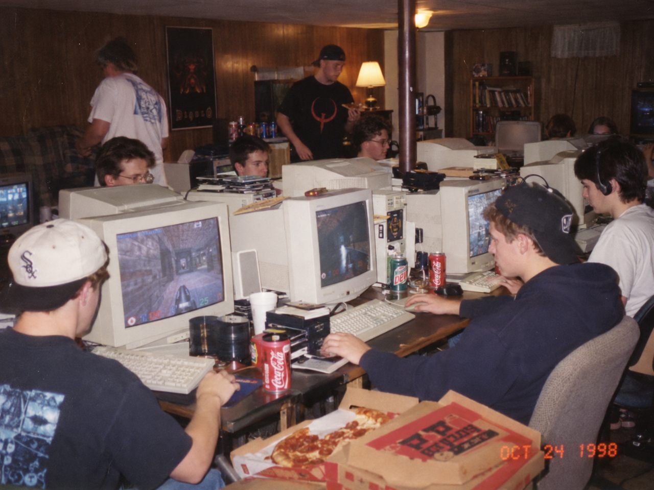 A LAN party in 1998: friends at CRT monitors, pizza boxes on the table